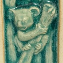 Oilburner, rectangular with koala design, blue glaze 7.5x7.5x11.7cm