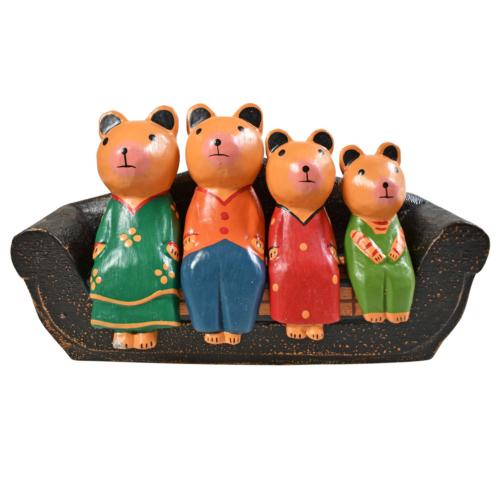 Family of 4 bears on a sofa hand carved Albesia wood, 21 x 10 x 6cm