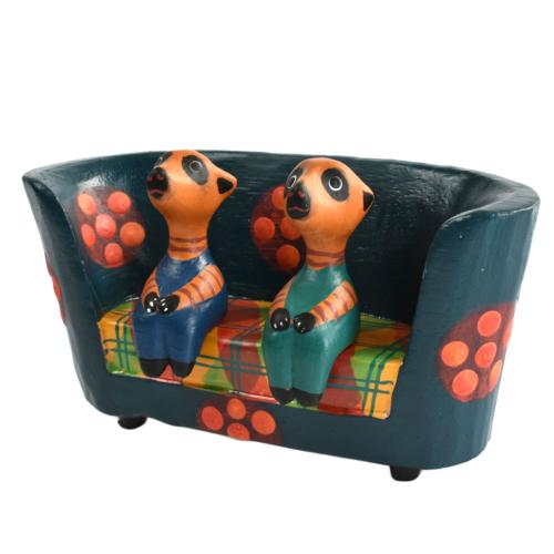 2 Meerkats in a floral sofa hand carved from Albesia wood,15 x 8 x 4cm 